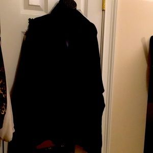 Chico’s reversible “Ruana” travel wrap in Grey and black.